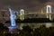 Nightshot of a replica of the Statue of Liberty and a suspension bridge in Tokyo