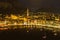 Nighttime aerial cityscape of Lecco town. Picturesque waterfront of Lecco town located between famous Lake Como and scenic Bergamo