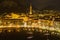 Nighttime aerial cityscape of Lecco town. Picturesque waterfront of Lecco town located between famous Lake Como and scenic Bergamo