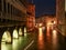 Nighttime cityscape of a canal in Venice