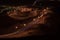 Nighttime long exposure of Viewpoint of twisted highway on Jebal Hafeet aka Jebel Hafit in Al Ain, UAE