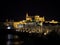 Nighttime panorama of historical arch Roman Bridge of Cordoba river Guadalquivir and mosque cathedral Andalusia Spain