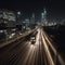 Nighttime Rush Hour Train with City Skyline