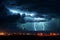 Nighttime storm illuminated by a dramatic and powerful lightning strike