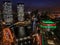 Nighttime view of Chicago cityscape with holiday/Christmas colors illuminated over the water.