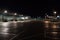 nighttime view of empty airport terminal with dimmed lighting, and distant sounds of airplanes
