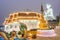 Nighttime at Wat Huay Pla Kang temple,lit up,with Big Buddha towering beyond,Chiang Rai City,Thailand