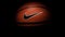 Nike brand, basketball ball Nike Baller. Orange rubber outdoor ball, ultra-durable cover, close-up on a black background