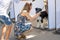 Nikolaev, Ukraine- August 15, 2020: volunteer exhibition of stray dogs. Dog training, preparation for exhibition, pets. Girl and