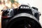Nikon D850 camera front view detail focus on logo name professional photography equipment
