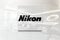 Nikon on glossy office wall realistic texture