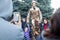 NIKOPOL, UKRAINE - 09/28/2021: Close-up of stilt walkers at the fair. Male acrobats dressed in shiny mirrored costumes. The