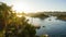 Nile river bank in Egypt sunset sky and palm tree with sand dessert slope in the back