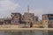 Nile River, Egypt: Colorful houses, laundry and carpets drying in the sun