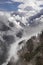 Nilgiri mountain peak and cloudy Himalayas