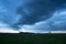 Nimbostratus Of Gray-Blue Color Over Agricultural Field In Evening Dusk In Spring