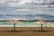 Nin, Croatia - Two reed sunshades at the empty Queen`s Beach by the mediterranean town of Nin at the end of summer