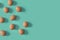 Nine brown eggs on a green background. The concept of minimalism to your design
