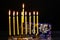 Nine burning candles on blurred background. Hanukkah concept