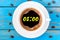 Nine hours or 8:00 on morning cup of coffee like a round clock face. Top view