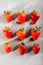 Nine juicy strawberry on grey background