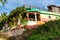 Nine Mile, Jamaica JANUARY 07, 2017: House decorated by the Bob Marley`s colors: Red, Yellow, Green. Outside of Mausoleum compoun