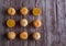 Nine orange ripe tandarines on brown wooden background