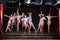 Nine showgils posing on stage