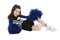 Nine year old Caucasian girl dressed in a blue cheerleader outfit