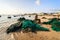 Ninh Thuan, Vietnam - Feb 22, 2014 : Fishermen is removing unusable fishing net at My Hiep beach in the afternoon