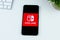 Nintendo Switch app logo on a smartphone screen.