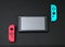 Nintendo Switch game console on black concrete background