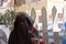 Niqabi woman veiled in souk or marketplace