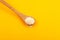 Nisin powder in wooden spoon, selective focus. Food additive E234, extremely effective against yeast and fungi even at very low
