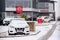 Nissan motor company cars standing in front of dealership building