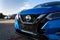 Nissan motor company cars standing in front of dealership building