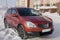 Nissan Qashqai in red color. This is crossover that combines modark design and compact hatchback refinement with functionality