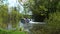 NISSWA, MN - 27 JUL 2022: Pontoon boat with people on a river.