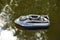 Nitaure, Latvia â€“ June 05, 2021: gps bait boat for fishing with carp bait floating on water