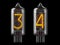 Nixie tube indicator. Number 3 three and 4 four on black background