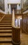 NIZHNY NOVGOROD - APRIL 18, 2023:A wooden staircase in the interior of a spacious building with paintings on the walls