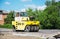NIZHYN, UKRAINE - MAY 25, 2018: A worker driving pneumatic roller compactor during the renovation of the road in summer