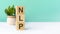 nlp - word from wooden blocks with letters, green background. copy space available