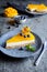 No bake mango cheesecake decorated with blueberries and physalis