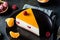 No Bake mango Cheesecake Decorated with Fresh raspberry and tangerine. Healthy dessert. Vegetarian food. Raw food. Raw