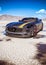 No brand dirt sport car on desert portrait wit copy space