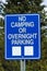 A no camping or overnight parking sign