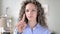 No, curly hair woman rejecting offer by waving finger