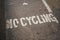 No cycling written on asphalt of pedestrian pathway tunnel