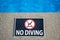 No diving warning sign at swimming pool